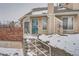 Townhouse entrance with stairs and a security gate at 2121 S Troy Way, Aurora, CO 80014