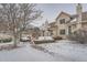 Attractive exterior of a townhouse with a landscaped yard and walkway at 2121 S Troy Way, Aurora, CO 80014