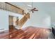 Open living area with hardwood floors, a loft, and a fireplace at 2121 S Troy Way, Aurora, CO 80014
