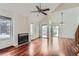 Bright living room featuring hardwood floors, a fireplace, and vaulted ceilings at 2121 S Troy Way, Aurora, CO 80014