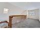 Spacious loft area with built-in shelving and window at 2121 S Troy Way, Aurora, CO 80014