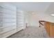 Open loft space with extensive built-in shelving at 2121 S Troy Way, Aurora, CO 80014