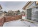 Private patio with brick wall and sliding glass door at 2121 S Troy Way, Aurora, CO 80014