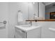 Simple, modern bathroom with sleek fixtures and a minimalist design, showing sink and a towel rack at 1750 Wewatta St # 700, Denver, CO 80202