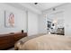 Bright bedroom featuring modern decor and a view into another room at 1750 Wewatta St # 700, Denver, CO 80202