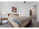 Cozy bedroom featuring a comfortable bed, stylish nightstands, and a view of a well-organized closet at 1750 Wewatta St # 700, Denver, CO 80202