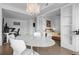 Dining room with seating for six and view into bedroom with closet, natural light at 1750 Wewatta St # 700, Denver, CO 80202