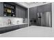 Close-up of modern kitchen featuring gray cabinets, stainless steel appliances, and a subway tile backsplash at 1750 Wewatta St # 700, Denver, CO 80202
