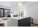 Bright, open kitchen island featuring a large quartz countertop with adjacent living and dining areas at 1750 Wewatta St # 700, Denver, CO 80202