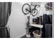 Functional laundry room with a bike, cleaning supplies, and extra storage space, plus washer and dryer at 1750 Wewatta St # 700, Denver, CO 80202