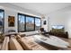 Modern living room with city views from large windows, hardwood floors, and stylish, contemporary decor at 1750 Wewatta St # 700, Denver, CO 80202