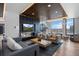 Comfortable lounge features a fireplace, large TV screen, modern furnishings, and city views at 1750 Wewatta St # 700, Denver, CO 80202