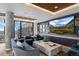 Modern lounge area with sleek furnishings, large windows, city views, and a decorative ceiling at 1750 Wewatta St # 700, Denver, CO 80202