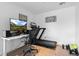 Modern office with a treadmill desk, large monitor, and minimalist decor, perfect for productivity at 1750 Wewatta St # 700, Denver, CO 80202