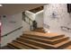 Modern staircase with wood treads and black accents leads to the front desk and residences at 1750 Wewatta St # 700, Denver, CO 80202
