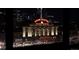Night view of the historic Union Station with its illuminated 'Travel by Train' sign at 1750 Wewatta St # 700, Denver, CO 80202