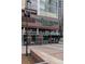 Exterior view of a Whole Foods Market with outdoor seating in front of the store at 1750 Wewatta St # 700, Denver, CO 80202