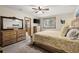 Bedroom featuring a wooden bedframe, carpeted flooring, and a large window offering natural light at 2857 Hiwan Dr, Evergreen, CO 80439
