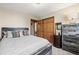 Bedroom featuring a rustic design with wooden accents and a comfortable bed at 2857 Hiwan Dr, Evergreen, CO 80439