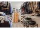 Walk-in closet with built-in shelving and hanging racks for organized storage at 2857 Hiwan Dr, Evergreen, CO 80439