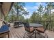 Expansive deck area ideal for outdoor entertaining with scenic views and ample seating at 2857 Hiwan Dr, Evergreen, CO 80439