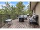 Inviting deck with comfortable seating and a fire pit, perfect for outdoor relaxation at 2857 Hiwan Dr, Evergreen, CO 80439