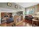 Open floor plan featuring a stone fireplace, a wine rack, and a view of the exterior at 2857 Hiwan Dr, Evergreen, CO 80439