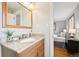 Bathroom with a granite vanity, brushed nickel fixtures, and natural light at 6320 E Asbury Ave, Denver, CO 80224