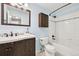 Updated bathroom with modern fixtures, sleek vanity, tiled shower, and stylish design at 6320 E Asbury Ave, Denver, CO 80224