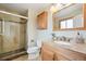 Bathroom featuring a shower, vanity and neutral decor at 6320 E Asbury Ave, Denver, CO 80224