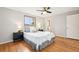 Cozy bedroom with wood floors and natural light from the window at 6320 E Asbury Ave, Denver, CO 80224