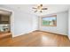 Well-lit bedroom featuring hardwood floors and a closet at 6320 E Asbury Ave, Denver, CO 80224