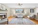 Cozy living room showcasing hardwood floors, fireplace, and contemporary decor at 6320 E Asbury Ave, Denver, CO 80224