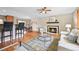 Spacious living area with hardwood floors, a fireplace, and an inviting layout at 6320 E Asbury Ave, Denver, CO 80224