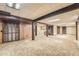 Large basement with carpet flooring, wood accents, laundry area, and good natural light at 8164 Flower Cir, Arvada, CO 80005