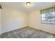 Bedroom with carpet, neutral colored walls, and window at 8164 Flower Cir, Arvada, CO 80005