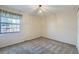 Bedroom with carpet, neutral colored walls, and window at 8164 Flower Cir, Arvada, CO 80005