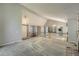 Open-concept living room with vaulted ceilings, exposed beams, and modern chandelier at 8164 Flower Cir, Arvada, CO 80005