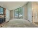 Bright, spacious living room featuring a large window and neutral carpeting at 8164 Flower Cir, Arvada, CO 80005