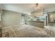 Open concept living room with kitchen in the background, great for entertaining at 8164 Flower Cir, Arvada, CO 80005