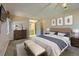 Serene main bedroom with neutral tones, a plush bed, and access to the ensuite bathroom, offering a relaxing retreat at 8164 Flower Cir, Arvada, CO 80005