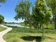 Scenic pond with walking path and lush greenery, providing a serene and tranquil outdoor space at 8164 Flower Cir, Arvada, CO 80005