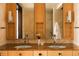 Elegant bathroom featuring a double sink vanity, decorative mirrors and marble wall at 1133 14Th St # 1820, Denver, CO 80202