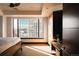 Bright bedroom with a large window, modern furniture, and a comfortable bed at 1133 14Th St # 1820, Denver, CO 80202