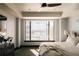 Bright bedroom with large windows offering city views, a comfortable bed, and contemporary decor at 1133 14Th St # 1820, Denver, CO 80202