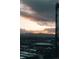 Panoramic city view showcasing a dramatic sunset over the mountains and a modern cityscape at 1133 14Th St # 1820, Denver, CO 80202
