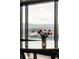 Elegant table arrangement highlighting the city and mountain views from the window at 1133 14Th St # 1820, Denver, CO 80202