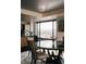 Elegant dining table arrangement highlighting the kitchen and city views from the window at 1133 14Th St # 1820, Denver, CO 80202