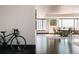 Bright dining area with hardwood floors, cityscape views, and stylish chairs around a dark wood table at 1133 14Th St # 1820, Denver, CO 80202