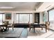 Dining area featuring a built-in bench under a large window, a modern rug, and elegant furnishings at 1133 14Th St # 1820, Denver, CO 80202